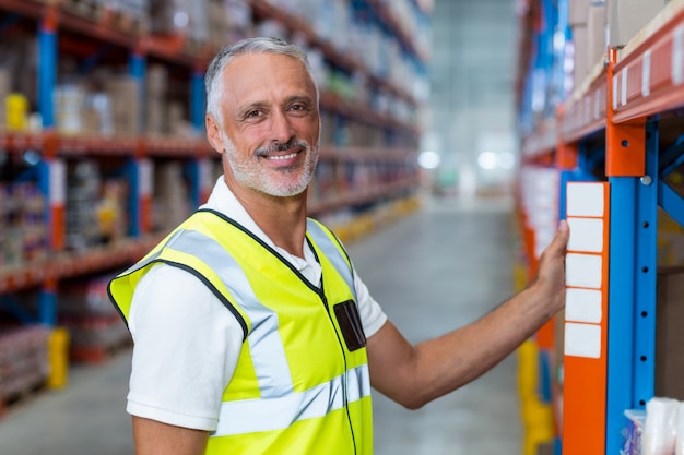 Portrait of happy worker is posing and looking the camera during work