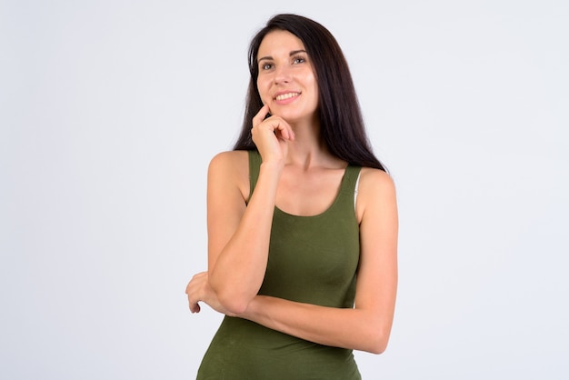 Portrait of happy young beautiful woman thinking and looking up