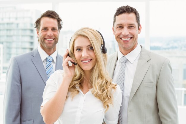 Portrait of happy young business people in office