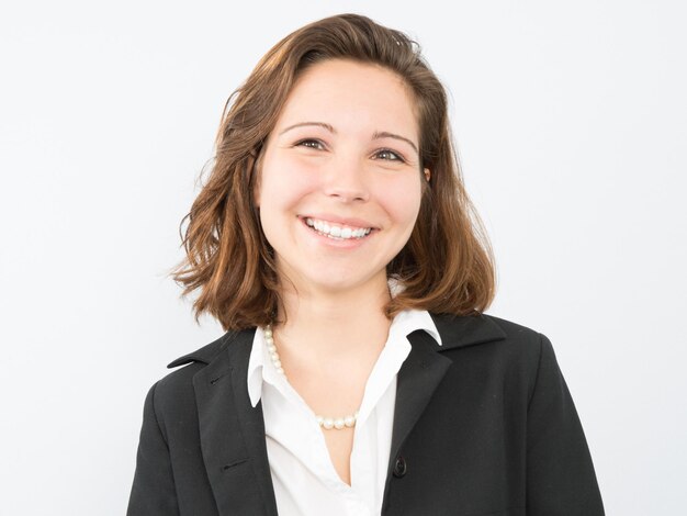 Portrait of happy young business woman isolated on white background