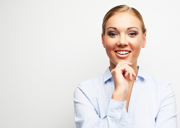 Portrait of happy young business woman over white background