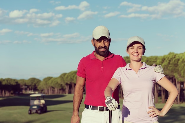 Photo portrait of happy young  couple on golf course