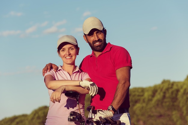 portrait of happy young  couple on golf course