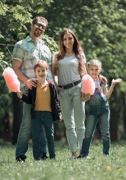 Portrait of a happy young family outdoorsthe concept of family entertainment