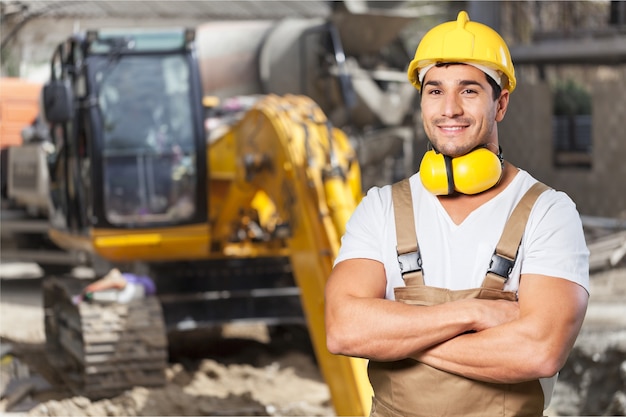 Portrait of happy young foreman with hard hat