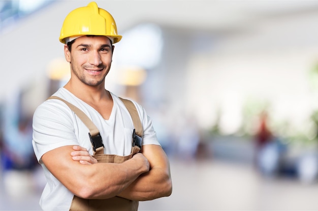 Portrait of happy young foreman with hard hat