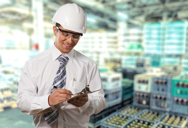 Portrait of happy young foreman with hard hat