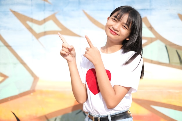 Portrait happy young girl on colorful background.