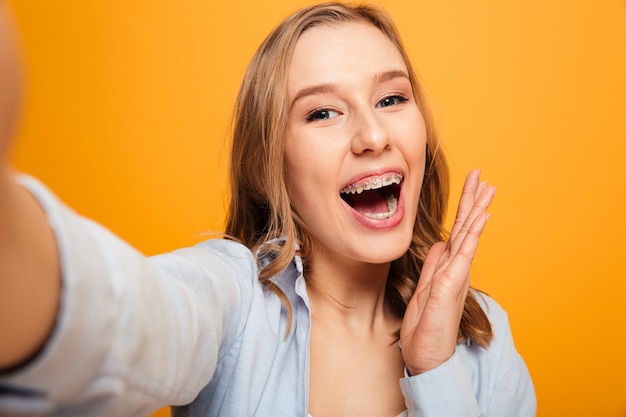 Portrait of a happy young girl with braces