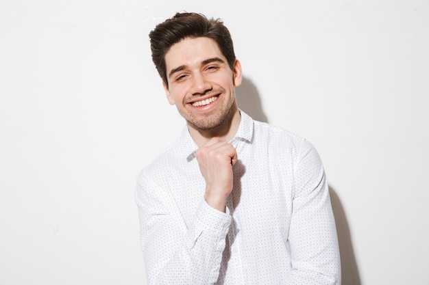 Portrait of a happy young man dressed in shirt