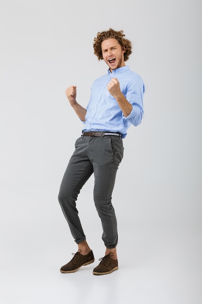 Portrait of a happy young man with curly hair