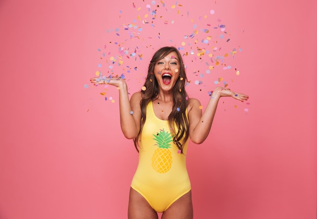 Portrait of a happy young woman dressed in swimsuit
