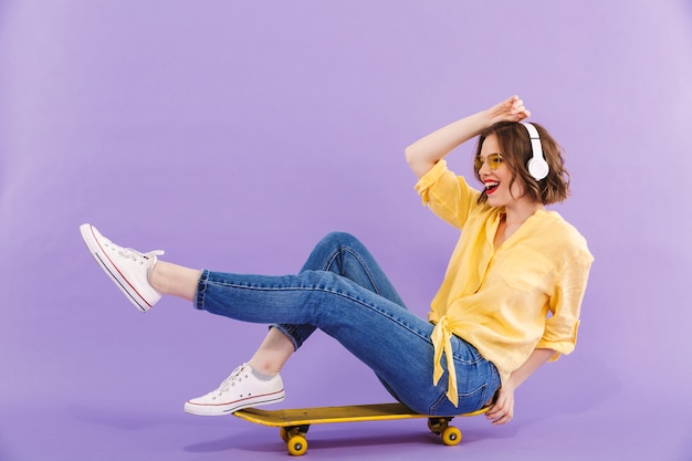 Portrait of a happy young woman in headphones