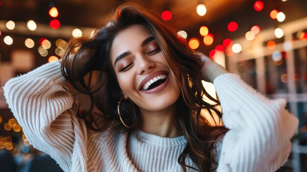 Portrait of a happy young woman laughing and having fun in cafe