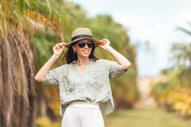 Portrait of happy young woman outdoor in the park