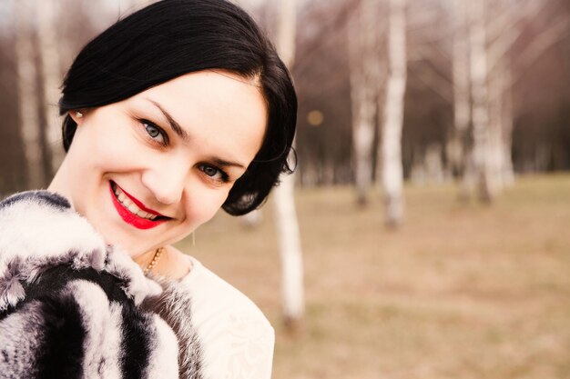 Portrait of happy young woman outside