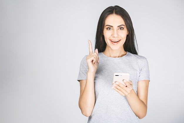 Portrait of a happy young woman using mobile phone