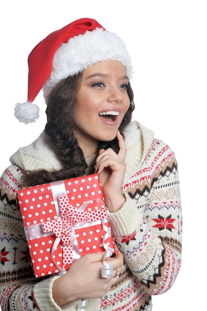 Portrait of happy young woman with Christmas present