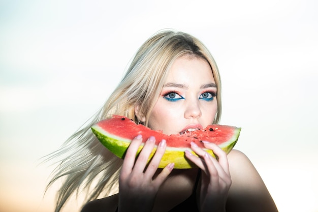 Portrait of a happy young woman with watermelon Youth lifestyle Happiness summer holiday