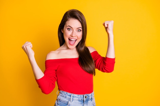 Portrait of her she nice attractive lovely gorgeous glad cheerful cheery lucky brown-haired girl celebrating great news isolated bright vivid shine vibrant yellow color background