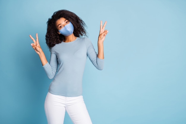 Portrait of her she trendy attractive girlfriend showing double v-sign copy space stop pandemia contamination influenza flue prevention viral pneumonia isolated blue pastel color background
