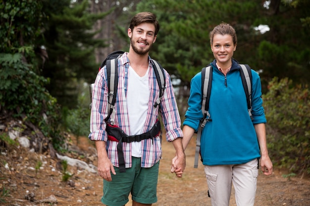 Portrait of hiker couple hiking in forest