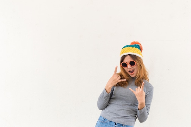 Portrait of hipster girl on white walllifestyle of modern teenCool hipster student woman wearing eyewear glasses