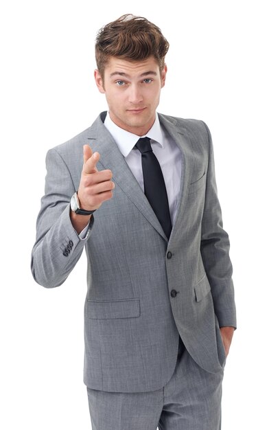 Portrait hiring and pointing with business man in studio isolated on white background for recruitment choice Corporate vote and hand gesture with confident young human resources employee in suit