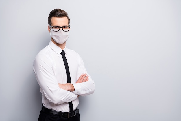 Portrait of his he nice experienced serious business guy folded arms wearing safety mask medicine health care disease mers cov preventive measures copy space isolated grey color background