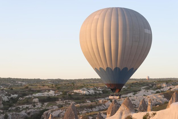 Portrait of hot air balloon in sky on mountain background popular tourist activity amazing view