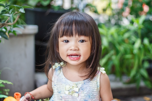 Portrait image of 2-3 years old baby. Face of Happy Asian child girl smiling.