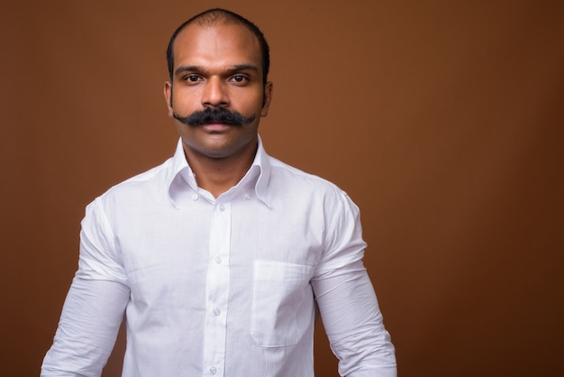 Portrait of Indian businessman with mustache in casual clothing