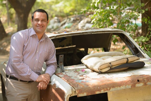 Portrait of Indian businessman with short hair in the streets outdoors