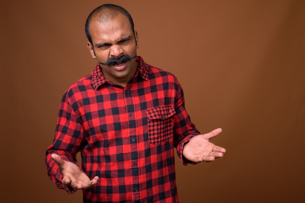 Portrait of Indian hipster man with mustache