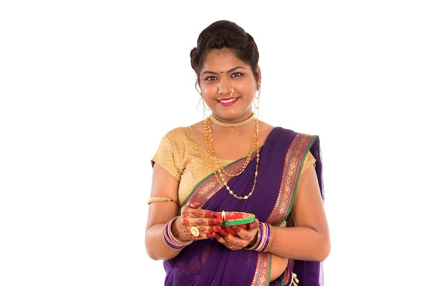 Portrait of a Indian Traditional Girl holding diya, Diwali or deepavali