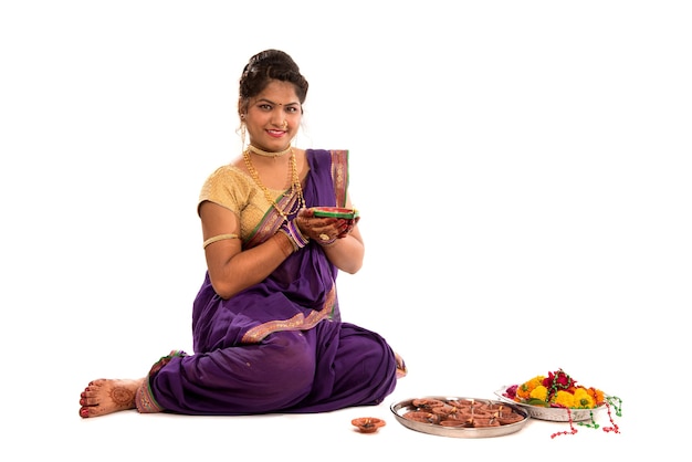 Portrait of a Indian Traditional Girl holding diya