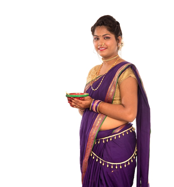 Portrait of a Indian Traditional Girl holding diya