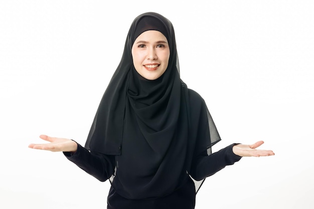 Portrait of islamic woman model smiling and posing on white isolated background Pretty muslim girl