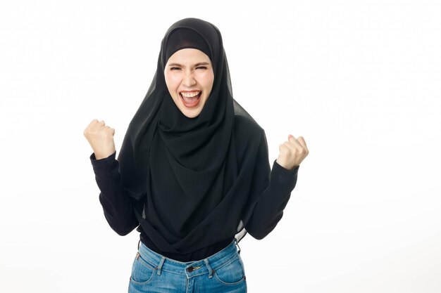 Portrait of islamic woman model smiling and posing on white isolated background Pretty muslim girl