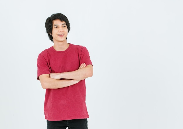 Portrait isolated cutout full body studio shot of Asian young handsome smart confident male model in street style outfit t shirt denim and sneakers standing posing look at camera on white background