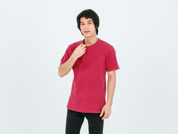 Portrait isolated cutout full body studio shot of Asian young handsome smart confident male model in street style outfit t shirt denim and sneakers standing posing look at camera on white background