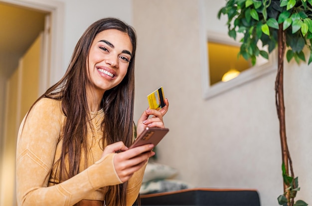 Portrait of joyful adult young woman canceling her purchase on phone