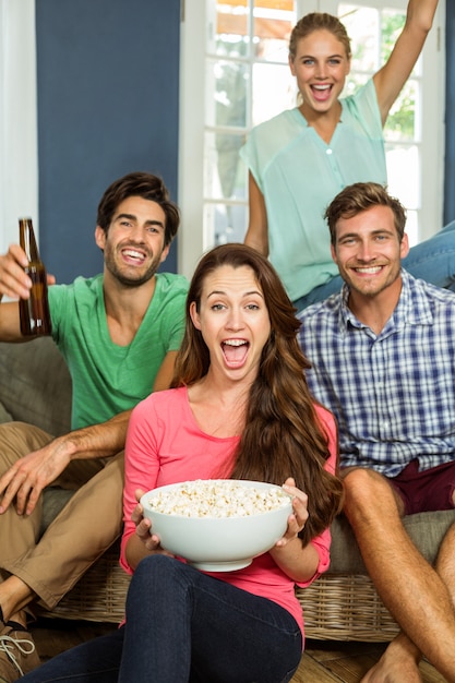 Portrait of joyful friends at home