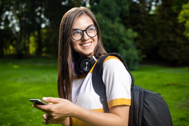 Portrait of joyful student girl pleasantly