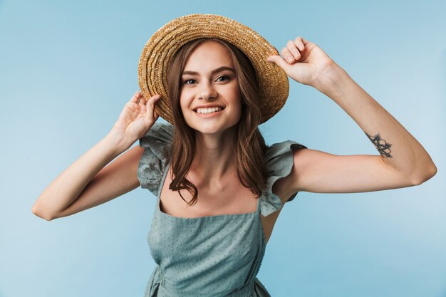 Portrait of a joyful young woman in dress