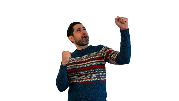 Portrait of joyous caucasian man celebrating with raised hand success