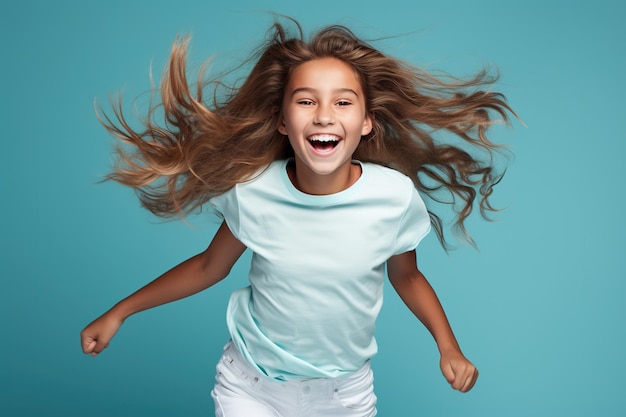 Portrait of jumping teenage girl on color blue background