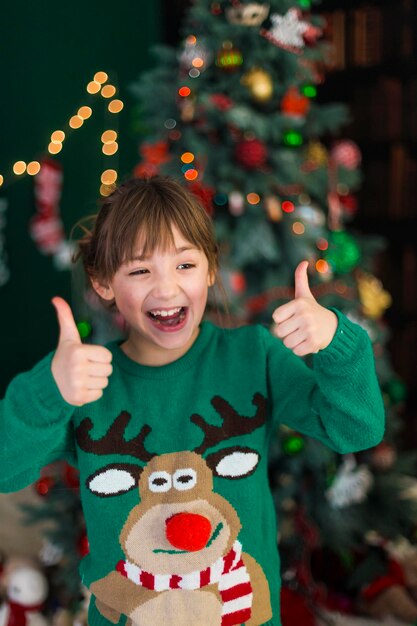 Portrait of Kid Girl Showing Thumbs Up