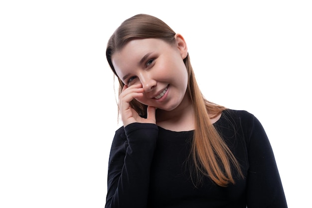 Portrait of a kind european schoolgirl on a white background with copyspace