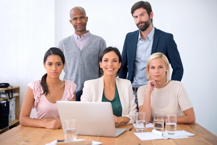 Photo portrait laptop and group of colleagues in office professional and working for creative company men women and employees or staff of business in collaboration meeting and copywriters with smile